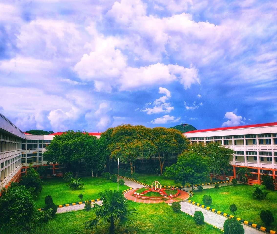 The university campus courtyard and academic buildings